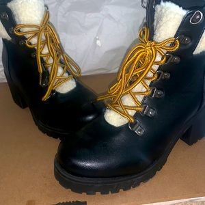 Black boots with a thick heel and white fur